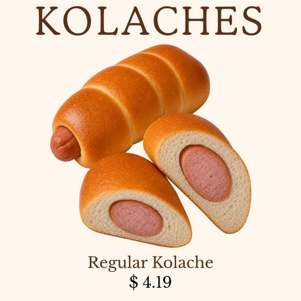 Three kolaches, one whole and two cut in half, revealing the sausage inside the bread.